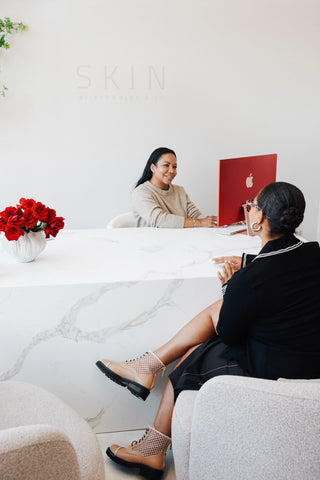 Experienced dermatologist assesses a client's skin, offering tailored solutions for healthier, more radiant results.